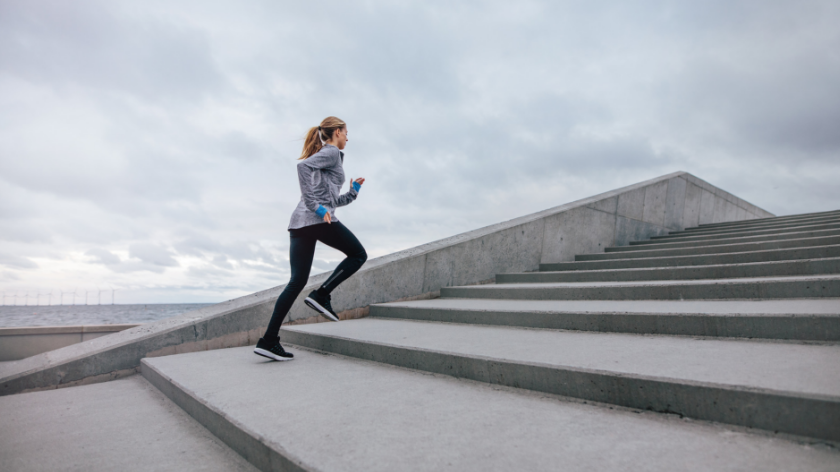 Woman running on stairs outdoors - Vitality