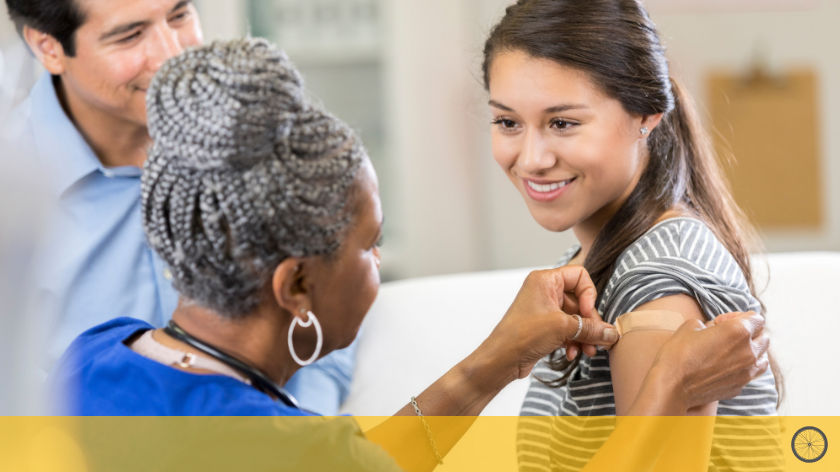 Woman gets vaccination from health professional - Vitality