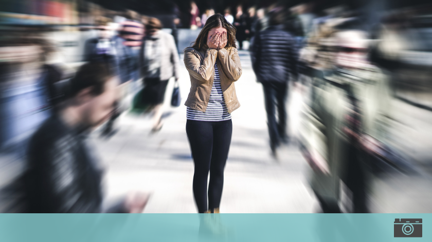 Stressed woman in a crowd for employers to take note - Vitality
