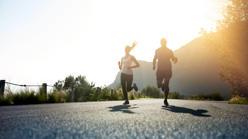 People jogging on an outdoor path to remove barriers to health - Vitality