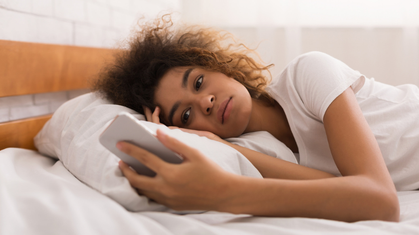 Woman in bed would benefit from dumbing down smartphone - Vitality