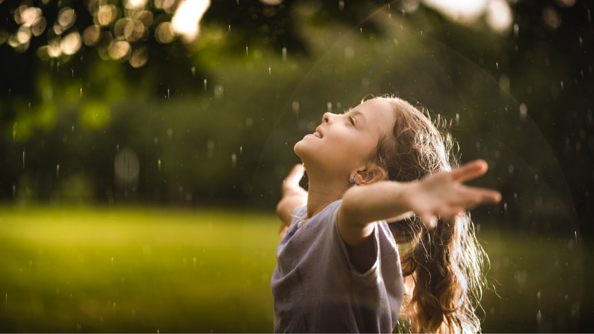 Young happy girl embracing the outdoors and the power of good feelings - Vitality