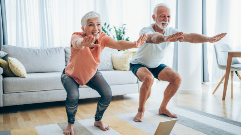 Two adults working out at home - Vitality