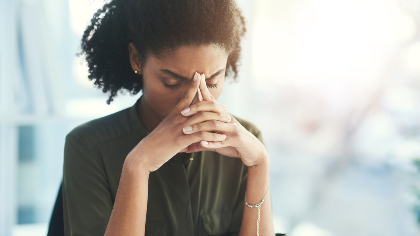 Woman feeling stressed in the workplace - Vitality