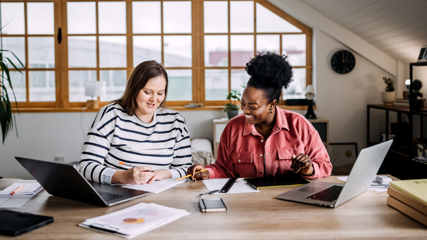 Two women co-work at home for a well-structured workday - Vitality