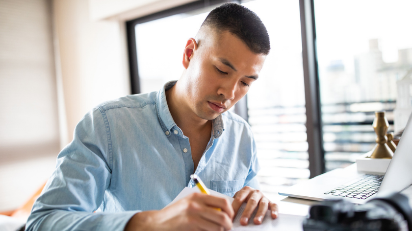 Man filling out forms to track actions - Vitality