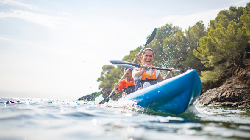 Couple kayaking in summer practicing staying safe - Vitality