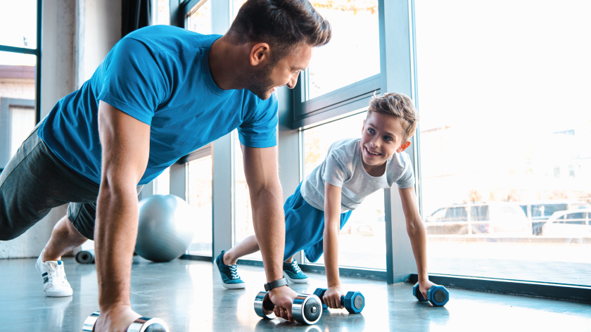 Dad and son doing pushups to form healthy habits - Vitality