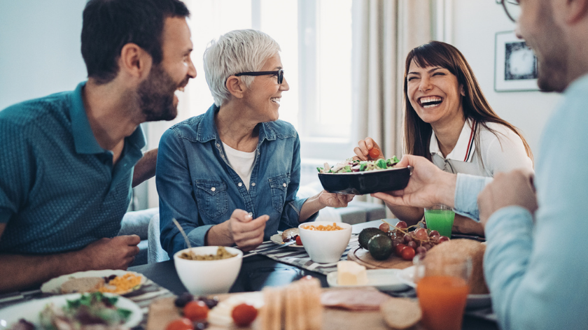 Laughing during family dinner - Vitality