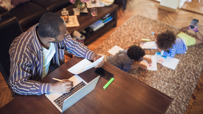 Man entertaining children while working from home - Vitality