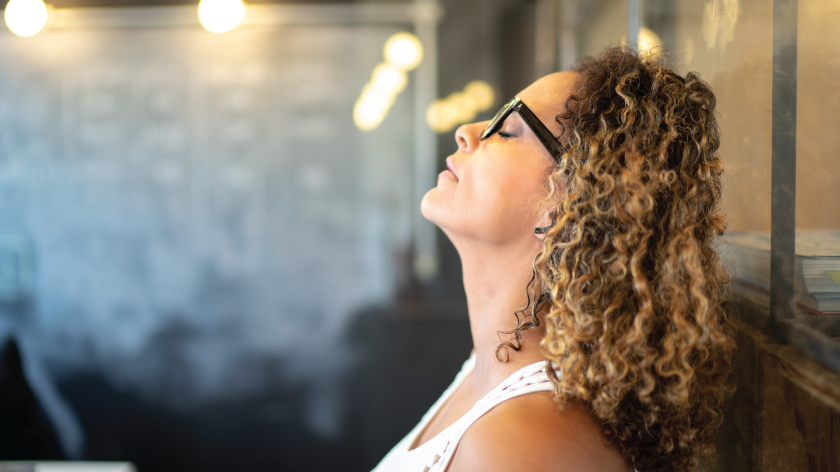 Woman relaxing taking a break to combat her inner critic - Vitality