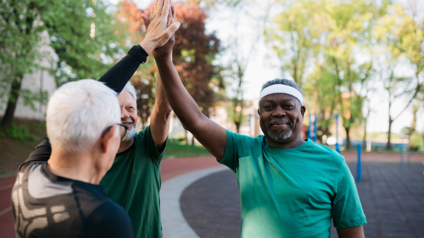 Senior men give high five after workout - Vitality