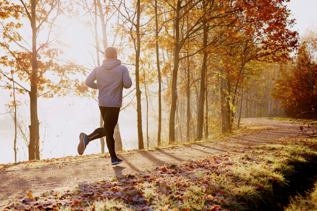 Person running outside in the fall